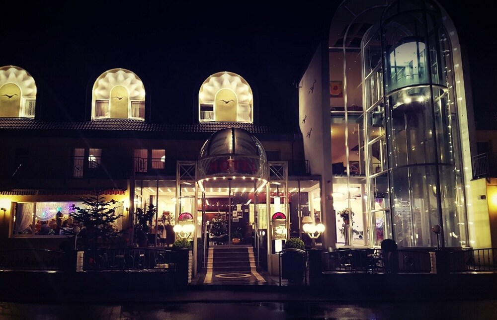 Hotel Front - Evening/Night