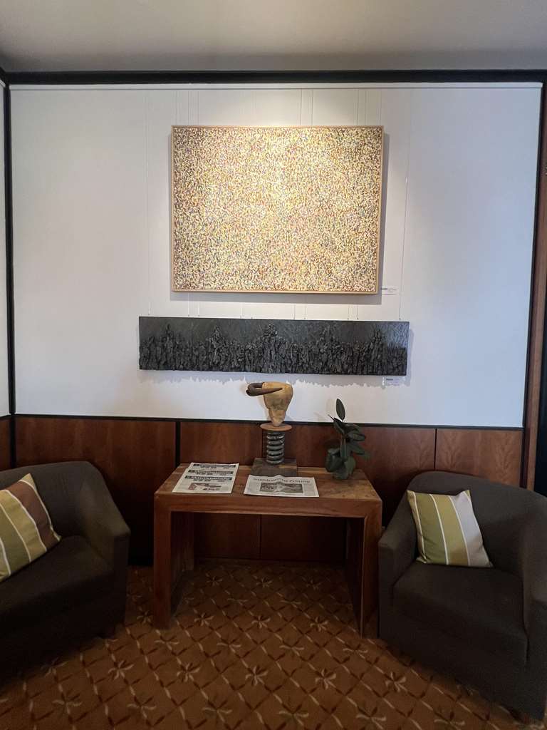 Seating area in the lobby with daily newspaper