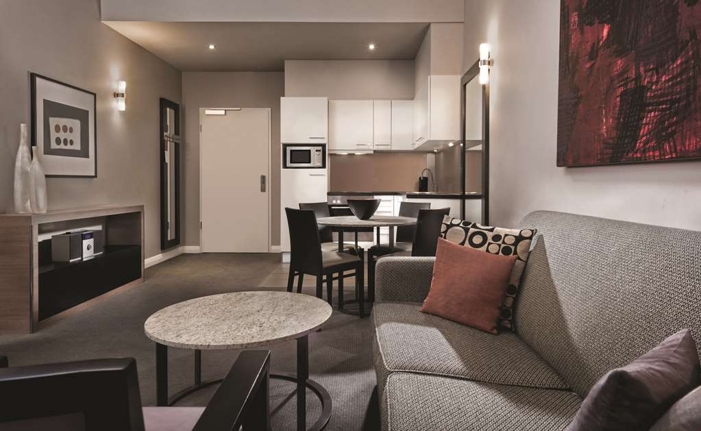 adina apartment hotel berlin checkpoint charlie two bedroom apartment lounge room and kitchen