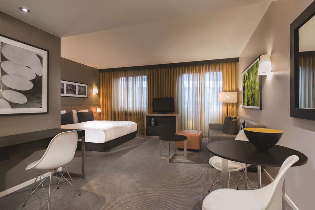 adina apartment hotel berlin mitte studio room lounge room and bedroom