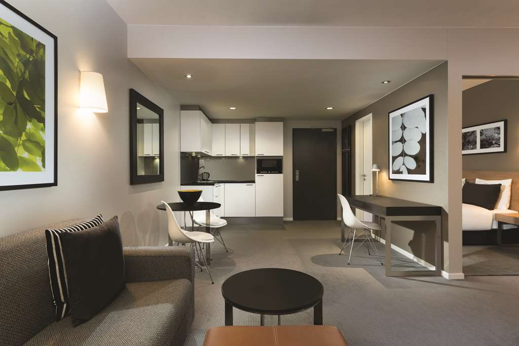 adina apartment hotel berlin mitte studio room kitchen and lounge room