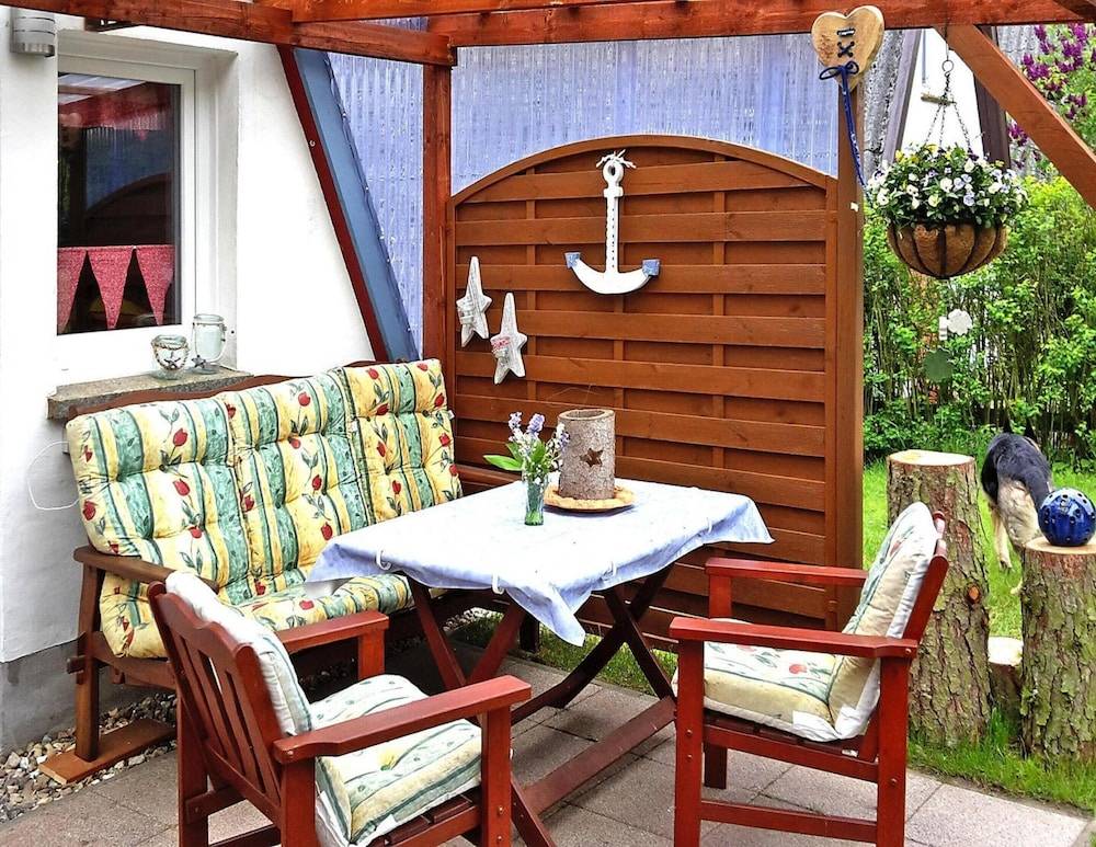Roof House Near Dummer See With Rowing Boat